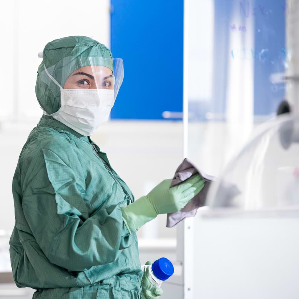 An employee wearing a PPE kit while performing the cleaning at hospital | Coor
